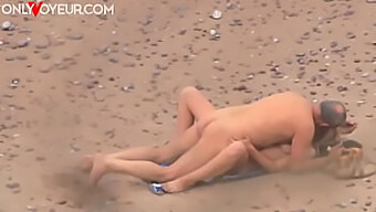 Public Sex On The Beach: Busty Blonde And Muscular Stud In Action