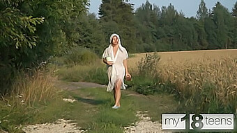 A Charming Girl Engages In Self-Pleasure During A Stroll In The Countryside